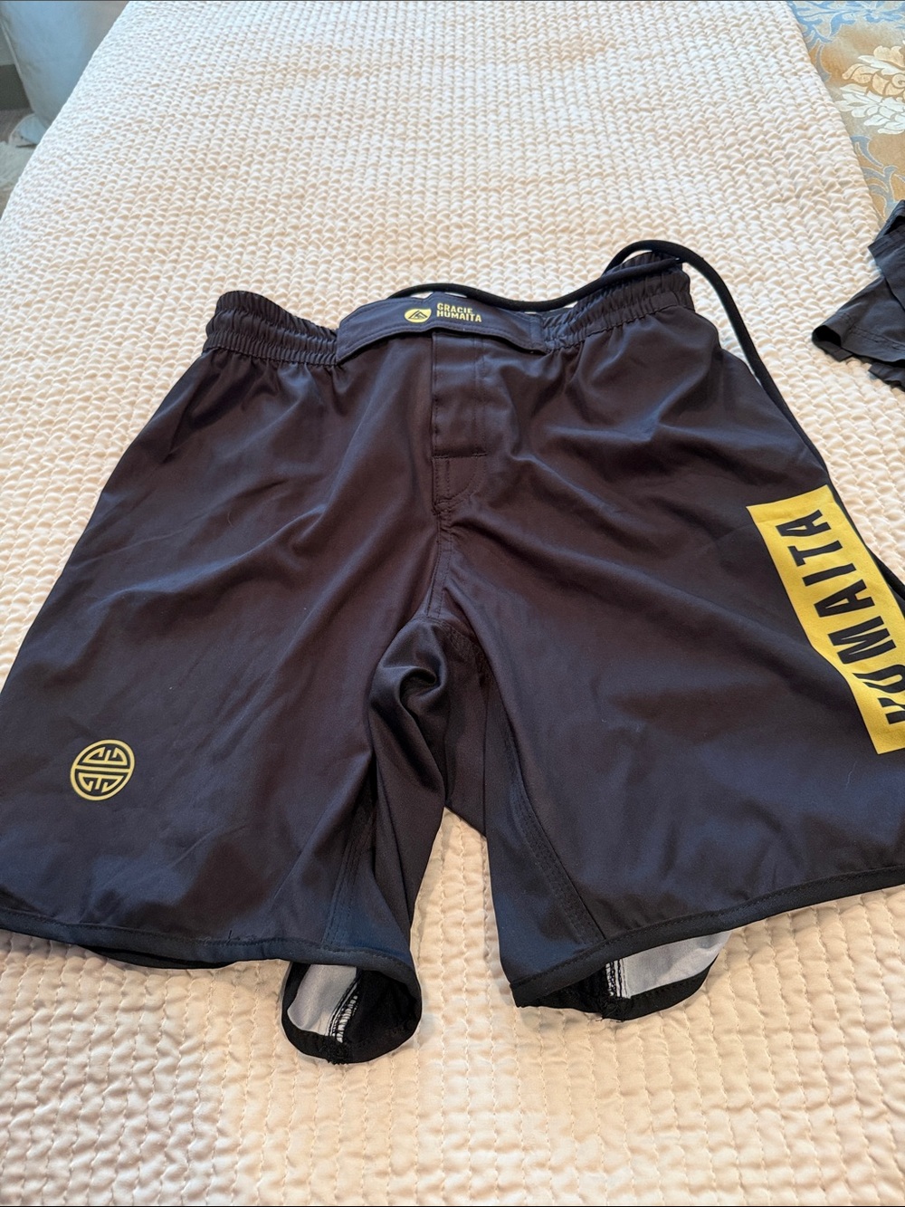 Gracie  Humaitia  shorts with Yellow Gracie Humaita Logo. Velcro closure.
